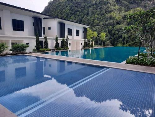 an empty swimming pool in front of a house at Hotspring 2 Room Suite 1912 @ Sunway Onsen (Neighbour of Lost World of Tambun) in Ipoh