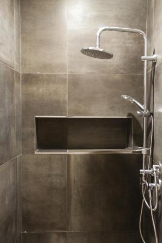 a shower with a sink and a shower head at Nonna Sicula in Agrigento