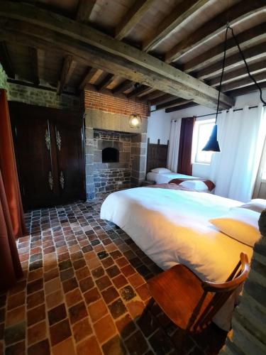 מיטה או מיטות בחדר ב-Le Fournil du Bertry