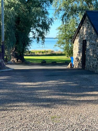 a stone building with a view of the ocean at Green Monkey Lodge in British