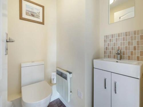 a bathroom with a toilet and a sink at Apartment 2 - Mount Brioni in Downderry