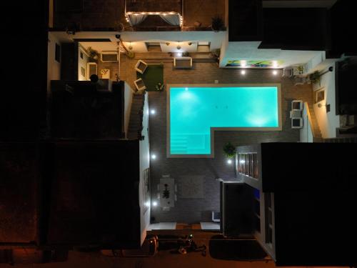 an overhead view of a building with a swimming pool at Salentuosi - Salento Mille e una Notte in Racale