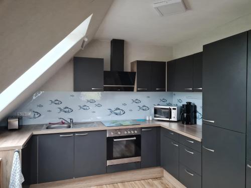 Kuchyň nebo kuchyňský kout v ubytování Ferienwohnung Schmidt