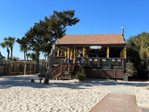 a building with a playground on the beach at Family Getaway - Boardwalk to the Beach, 3 pools, Tennis in Hilton Head Island