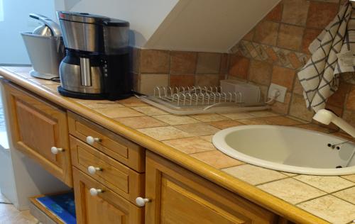 a kitchen counter with a sink and a coffee maker at Rue de France mer à 200m in Nice