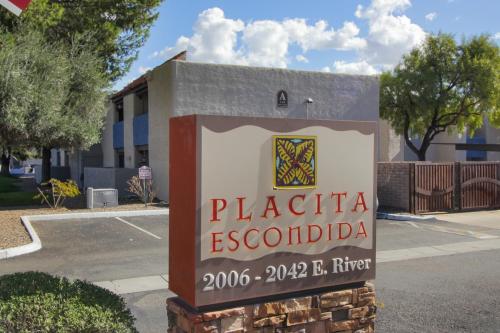 a sign for the plaza escondido in front of a building at DESERT JEWEL in Tucson