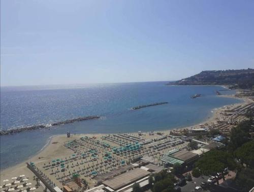 an aerial view of a beach with a resort at Casa Sveva, a pochi passi dalle spiagge e dal centro di Arma di Taggia. in Arma di Taggia