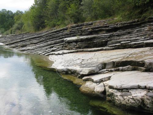 a river with rocks next to the water at Ferienwohnung Hager Kuchl in Kuchl