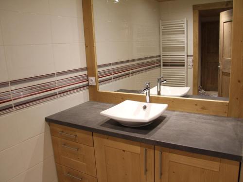 a bathroom with a sink and a mirror at Appartement La Clusaz, 3 pièces, 6 personnes - FR-1-459-87 in La Clusaz