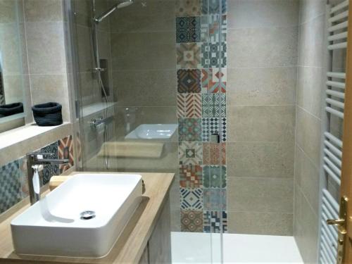 a bathroom with a sink and a shower at Appartement La Clusaz, 4 pièces, 7 personnes - FR-1-459-167 in La Clusaz