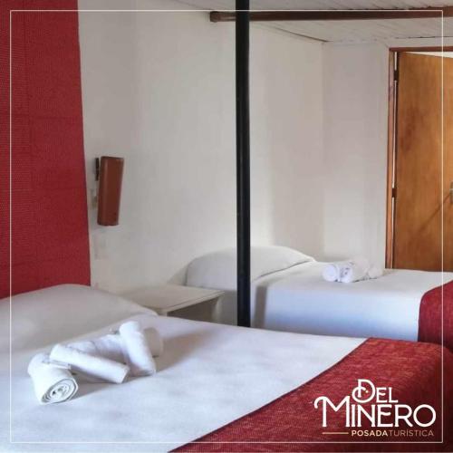 Ένα ή περισσότερα κρεβάτια σε δωμάτιο στο La Posada del Minero