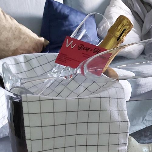 a glass box with a sign on top of a bed at Rosyshome102 in Vecindario