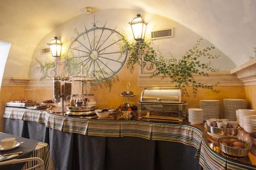 a kitchen with a table with food on it at Hotel S. Anna in Rome