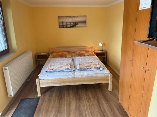 Postel nebo postele na pokoji v ubytování Apartmány Forró Rybárska