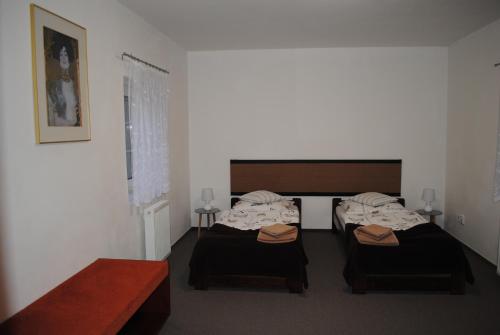 A bed or beds in a room at Apartmán Štěpánka