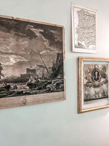 three framed pictures on a wall with a painting at Bombastic Home - Steps to Beach - GameRm - Hot Tub - Pet Friendly in Surf City