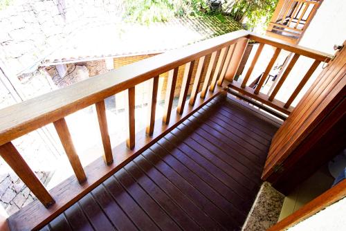 an overhead view of a wooden stairway at Hotel Praia do Portinho in Ilhabela