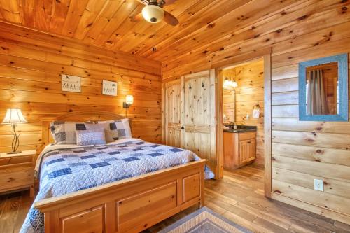 a bedroom with a bed in a log cabin at Hawk's View Log Cabin in Lake Lure