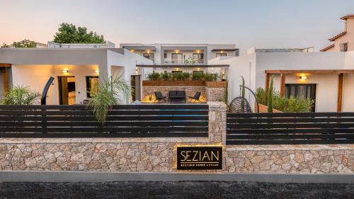 a house with a sign in front of it at Sezian Boutique Homes and Villas in Preveza
