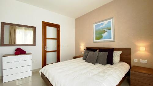 Ένα ή περισσότερα κρεβάτια σε δωμάτιο στο Quisisana Apartments - Cast Renting