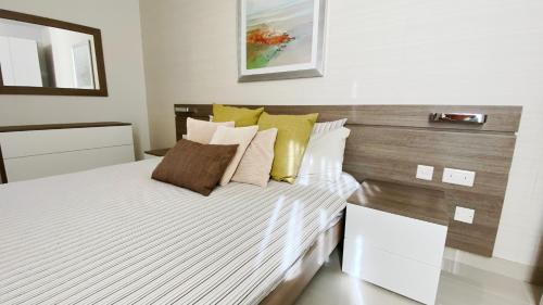 Ένα ή περισσότερα κρεβάτια σε δωμάτιο στο Quisisana Apartments - Cast Renting