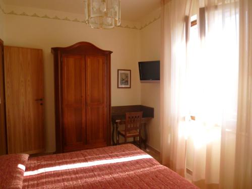 Ένα ή περισσότερα κρεβάτια σε δωμάτιο στο Casa Campiglione