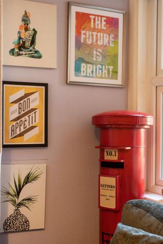 a corner of a room with posters on the wall at Springfield Place - 3 Bed Cent Reading - Long term savings - Free Parking in Reading