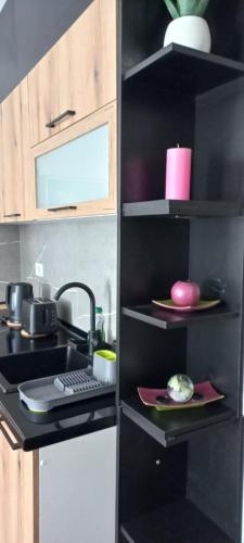 a kitchen with a sink and a counter top at President KOP A515 in Kopaonik