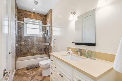 a bathroom with a sink and a toilet and a shower at Stunning TH #5 in Los Angeles