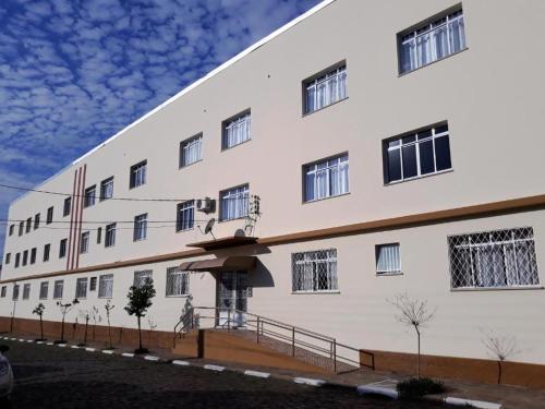 a large white building with windows on the side of it at Pousada Irmãs Franciscanas in Lages