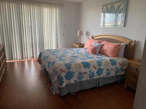 a bedroom with a bed with pillows on it at Atlantic Oasis on the Ocean in Key West