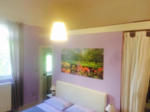 Postel nebo postele na pokoji v ubytování B&B La corte 2