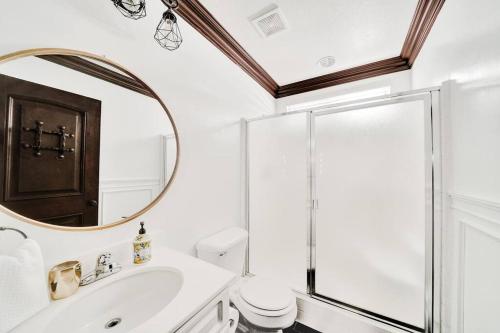 a bathroom with a sink and a mirror at Vino Villa Large home Sleeps 10! Large Salt water pool/spa in Murrieta