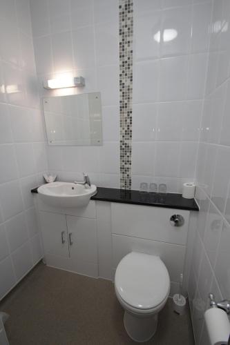 Ένα μπάνιο στο Lion Hotel & Studio Apartments