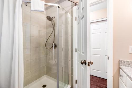 a shower with a glass door in a bathroom at Live Laugh Lake - A in Rushville