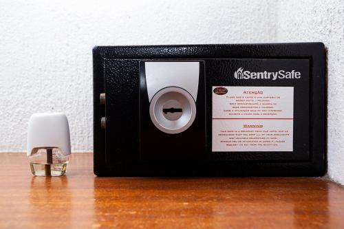 a small black box with a candle on a table at Hotel Praia do Portinho in Ilhabela