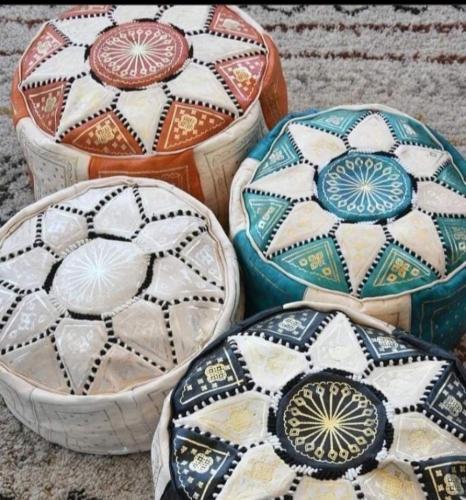 a group of different colored bowls sitting on the ground at Marrakech in Marrakech