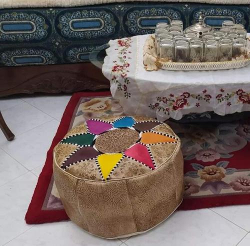 a table with a table with a bowlasteryasteryasteryasteryasteryasteryasteryastery at Marrakech in Marrakesh