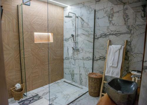 a bathroom with a shower with a glass door at Antonakis Villa Rhodes Private Pool & Jacuzzi Retreat in Kremasti