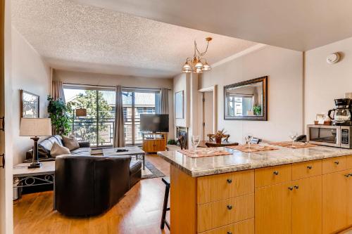 a kitchen with a counter and a living room at EDELWEISS HAUS 115A condo in Park City