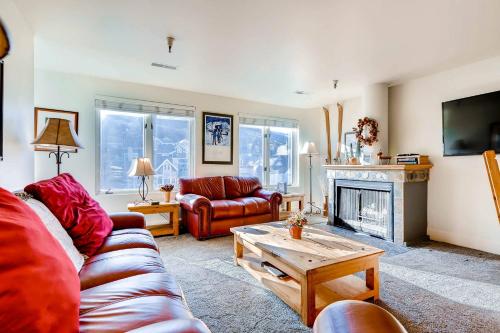 a living room with a couch and a fireplace at FASHION COALITION 402 condo in Park City