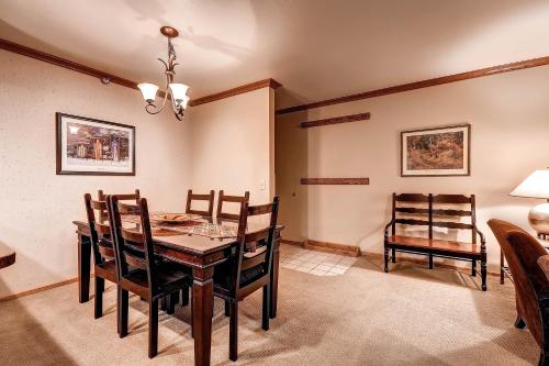 a dining room with a table and chairs at PARK STATION 247-1 condo in Park City