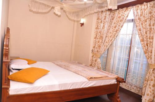 Кровать или кровати в номере Ragith Villa