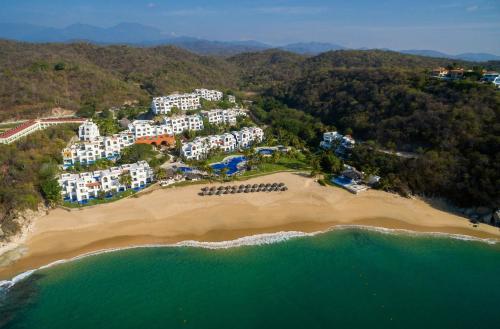 an aerial view of a resort on a beach at Camino Real Zaashila Huatulco in Santa Cruz Huatulco