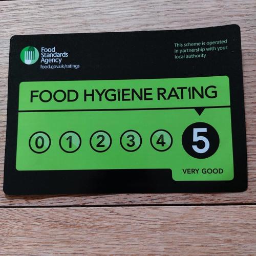 a food hygiene rating sign on a table at The Five Dials Inn in Ilminster