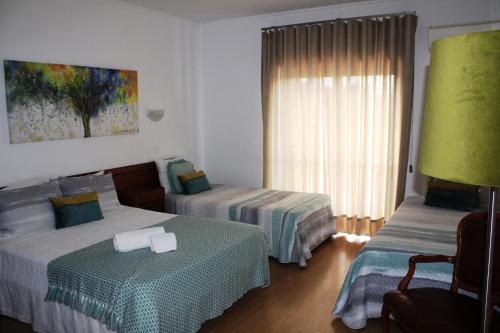 Ένα ή περισσότερα κρεβάτια σε δωμάτιο στο Hotel Larverde