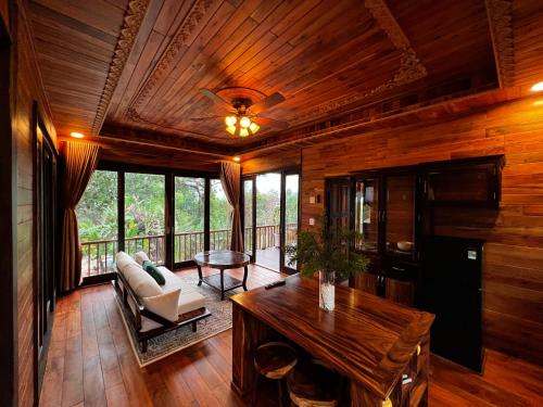 a living room with a couch and a table at Ong Huong House Can 2 in Phu Quoc