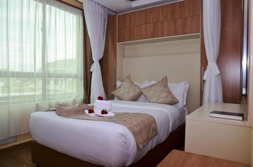 Postel nebo postele na pokoji v ubytování Hylise Hotel
