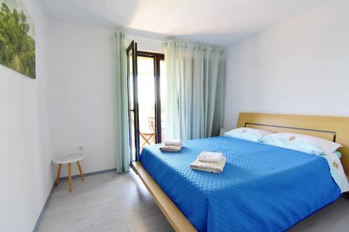 Posteľ alebo postele v izbe v ubytovaní Apartments with a parking space Umag - 20422