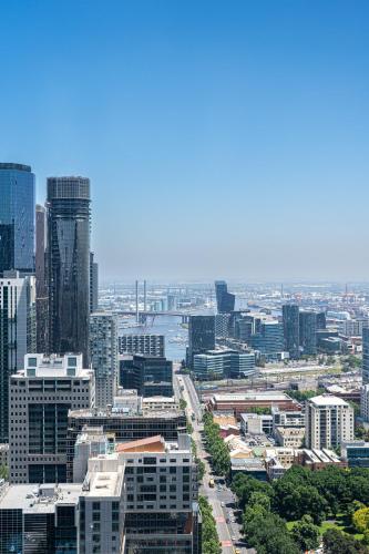 an aerial view of a city with tall buildings at Paragon Apartments by CLLIX in Melbourne